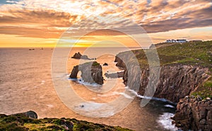 Dramatic sky at sunset with Enys Dodnan and the Armed Knight rock formations at Lands End