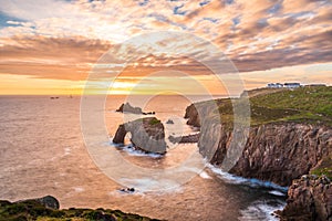 Dramatic sky at sunset with Enys Dodnan and the Armed Knight rock formations at Lands End