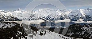 Dramatic snow covered mountains Landscape. Amazing Panoramic snowy winter landscape in Alps at sunrise morning. View