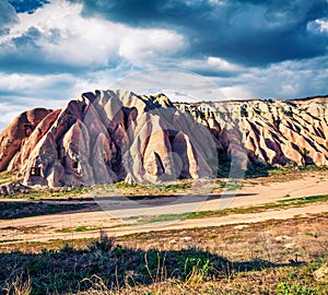 Dramatic spring scene of Cappadocia. Picturesque morning view of of Red Rose valley in April. Cavusin village located, district of