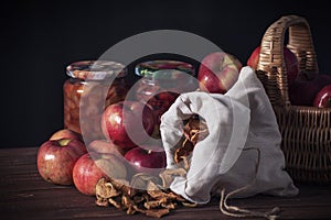Dramatic still life of various fruits and jars of jam