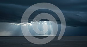 Dramatic storm clouds over ocean with sunlight beaming through