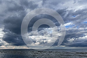 Dramatic stormy dark cloudy sky over Baltic sea