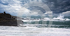 Dramatic stormy sea and thunderous sky with large waves