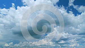 Dramatic Summer cloudscape. Blue sky white clouds. Changing cloudscape. Time lapse.