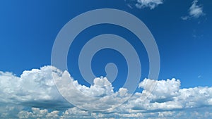 Dramatic Summer cloudscape. Blue sky white clouds. Changing cloudscape. Time lapse.