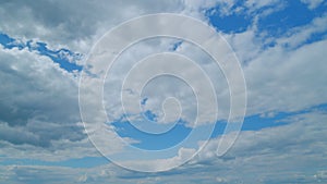 Dramatic Summer cloudscape. Blue sky white clouds. Changing cloudscape. Time lapse.