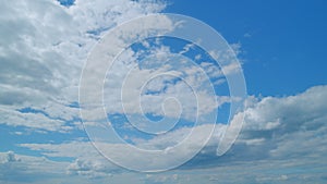 Dramatic Summer cloudscape. Blue sky white clouds. Changing cloudscape. Time lapse.