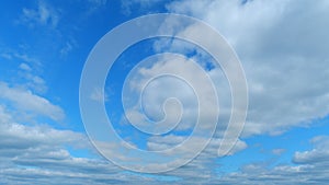 Dramatic Summer cloudscape. Blue sky white clouds. Changing cloudscape. Time lapse.