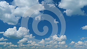 Dramatic Summer cloudscape. Blue sky white clouds. Changing cloudscape. Time lapse.