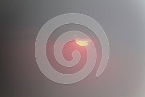 Dramatic sun breaking through heavy overcast clouds