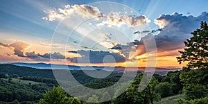 Dramatic sunrise with blue sky and orange sun rays