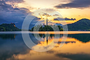 Dramatic sunrise on lake Bled, sunrise view on Bled lake, island