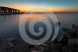 Dramatic sunrise with silky water view in Al uqair ruined fort sea side Saudi Arabia