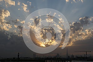 Dramatic Sunrise and Sunset in cloudy sky, Nature background with strong sunbeam, Hope concept.