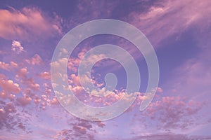 Dramatic sunrise, sunset pink violet blue sky with fluffy cirrus clouds abstract background texture
