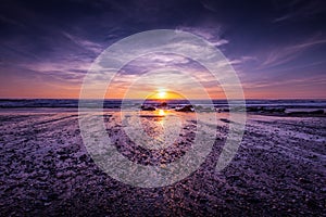 Dramatic sunset on the beach coast at Watergate Bay, Cornwall, England