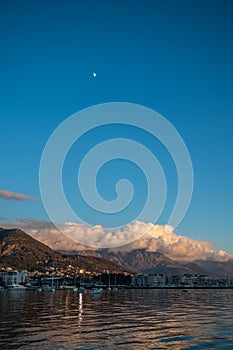 Dramatic sunset clouds over Tivat mountains on Adriatic coast, Montenegro