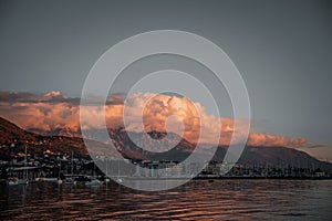 Dramatic sunset clouds over Tivat mountains on Adriatic coast, Montenegro