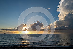 Dramatic sunset and cloudy sky. sea. Calm sea with cloudy sky through the clouds over. Sunset ocean and cloudy sky