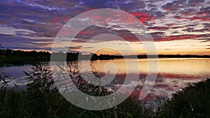 Dramatic sunset at a inland lake in Schleswig-Holstein Germany