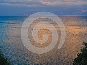 Dramatic Sunset Light on Clouds and Sea water, Greece