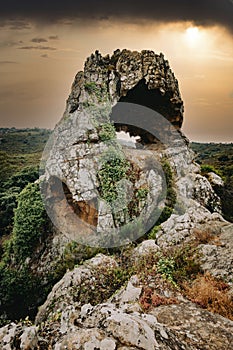 Dramatic sunset in Los Alcornocales Natural Park, with the rock called La Montera del Torero in the foreground.