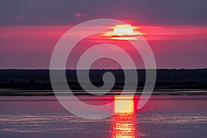 Dramatic sunset over Anglesey in Wales seen from Caernarfon - United Kingdom