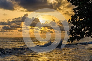 Dramatic sunset over Atlantic ocean with cloudy sky at Limbe, Cameroon, Africa