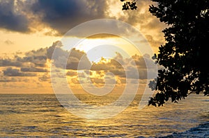 Dramatic sunset over Atlantic ocean with cloudy sky at Limbe, Cameroon, Africa