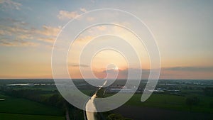 Dramatic sunset over canal Dessel Schoten aerial photo in Rijkevorsel, kempen, Belgium, showing the waterway in the