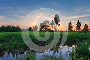 Dramatic sunset over field