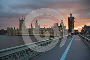 Dramatic sunset over the Houses of Parliament and Westminster Bridge. London, England
