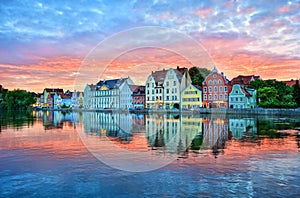 Dramatic sunset over old town of Landshut on Isar river near Mun photo