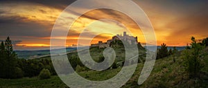 Dramatic sunset over the ruins of Spis Castle in Slovakia