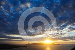 Dramatic sunset over Santorini caldera sea