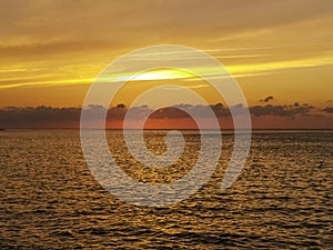 Dramatic sunset over the water on Cuban beach