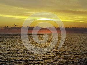 Dramatic sunset over the water on Cuban beach