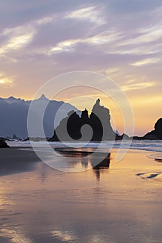 Dramatic sunset at Playa de Benijo, hidden beach in the northern part of the islands of Tenerife, Canary Islands, Spain