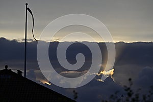 Dramatic Sunset with Rays of Light and Danebrog