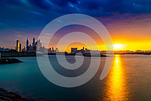 Dramatic sunset sky with clouds. Beautiful sunset over the Arabian sea in Dubai Marina UAE. Nature and beauty concept. Orange sund