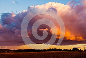 Dramatic sunset sky over field