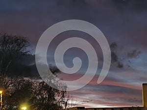 Dramatic Sunset Sky with Red and Gray Clouds