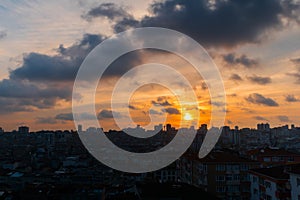 Dramatic sunset sky with the setting sun over the city, Istanbul, Turkey