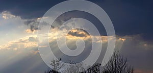 Dramatic sunset sky. Soft focus on cloud and Sunlight through the clouds at evening time