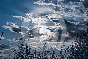 Dramatic sunset sky, sun rays in cloud, cold color