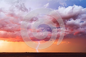 Dramatic sunset sky with thunderstorm and lightning