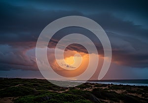 Dramatic Sunset Storm Clouds over Ocean Beach