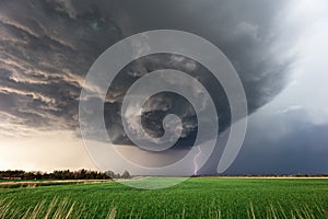 Dramatic supercell thunderstorm with lightning strike