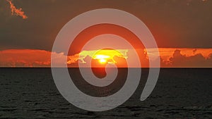 Dramatic red clouds at sunset sky